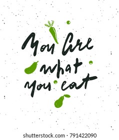 You are what your eat. Hand lettering poster. Silhouettes of vegetables. Design concept for eco food labels, markets, restaurants.