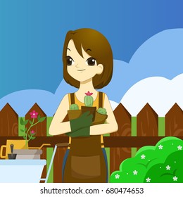Young adult woman holding succulents and ready to work in the garden