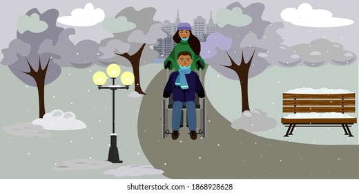 Young african american coupe walks in the winter deserted park. Man in the wheelchair. Man and woman wore medical masks and took them off to breathe fresh air. Life during the pandemic.