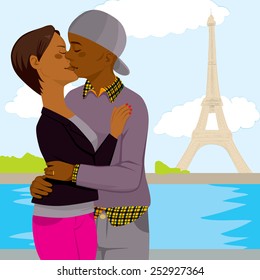 Young African American couple kissing and hugging, passionately full of love with Eiffel Tower in background in Paris on their honeymoon