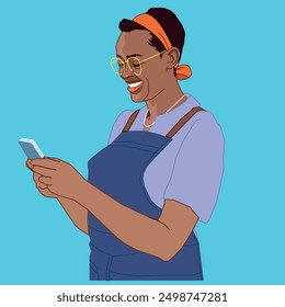 A young African American lady with hair tie and glasses smiling at the phone wearing an apron