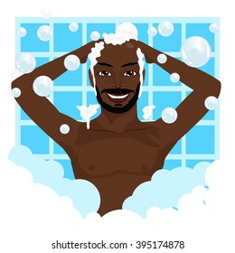 Young African American Smiling Man Washing His Hair With Shampoo 