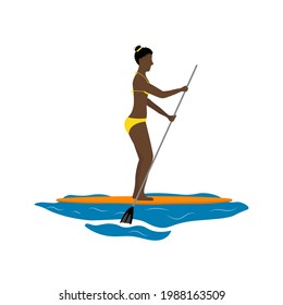 Young african american woman is enjoying paddling on her sup board.