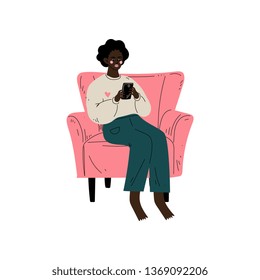 Young African American Woman Sitting in Armchair with Cup of Tea, Girl Spending Weekend at Home and Relaxing Vector Illustration