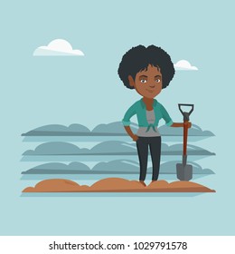 Young african farmer standing with a shovel on the background of plowed field. Farmer working in field with a shovel. Farmer plowing field with a shovel. Vector cartoon illustration. Square layout.