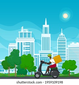 Young african guy in protective face mask with box for food delivery rides a gray scooter on a summer background of green trees and cities, online delivery service and stay home concept