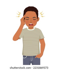 young African man having headache with hand squeezing his head because of stress, migraine, and having worries or anxiety problems