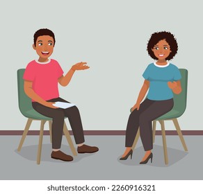 Young African man having psychotherapy counseling session with female psychotherapist in the office