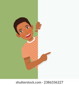 Young African man peeking from behind blank board pointing finger to empty banner for copy space advertising and announcement messages