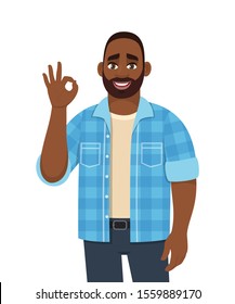 Young African man showing okay, cool gesture sign with fingers. Trendy happy looking black person making OK, good symbol. Male character design illustration. Modern lifestyle in vector cartoon.