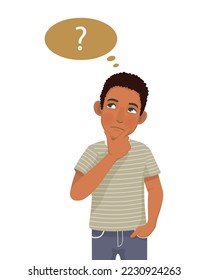 Young African man thinking looking up while touching his chin to find solution of problems