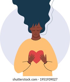Young african woman hugs a big heart with love and care. Girl with long hair holds red heart in her hands. Self care and body positive concept.