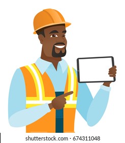 Young african-american builder holding tablet computer. Builder in hard hat pointing at tablet computer. Builder with digital tablet. Vector flat design illustration isolated on white background.