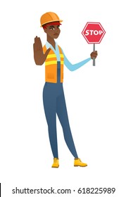 Young african-american builder showing stop road sign. Full length of builder holding stop road sign. Serious builder with stop road sign. Vector flat design illustration isolated on white background.
