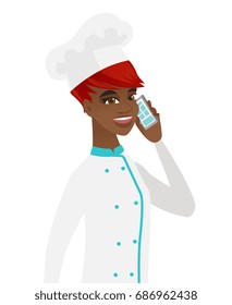 Young african-american chef cook in uniform talking on a mobile phone. Smiling chef cook talking on a cell phone. Chef using cell phone. Vector flat design illustration isolated on white background.