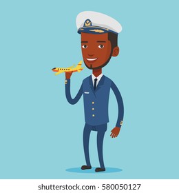 Young african-american pilot holding a model of airplane in hand. Cheerful airline pilot in uniform. Smiling pilot with model of airplane. Vector flat design illustration. Square layout.