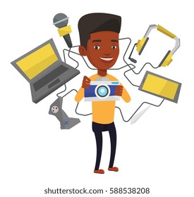Young african-american smiling man surrounded with many gadgets. Happy man using many electronic gadgets. Man addicted to modern gadgets. Vector flat design illustration isolated on white background.
