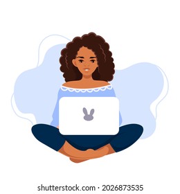 A young African-American woman in the lotus position is working at a laptop. A freelance girl. Work and study at home in a comfortable environment. Vector illustration in a modern cartoon style