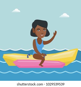 Young african-american woman riding a banana boat and waving hand. Cheerful woman having fun on a banana boat in the sea. Woman enjoying summer vacation. Vector cartoon illustration. Square layout.