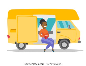 Young african-american woman sitting in motor home and drinking coffee. Woman enjoying vacation in a camper van. Tourism and camping concept. Vector cartoon illustration isolated on white background.