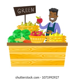 Young african-american worker of grocery store standing in the section with vegetables and fruit. Male seller offering fresh organic food. Vector cartoon illustration isolated on white background.