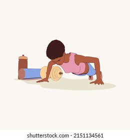 Young afro american female workout. Sport girl doing push up exercise. Sport fashion girl in urban casual style. Gym training and home exercising and fitness equipment. Dumbbell, yoga mat and bottle.