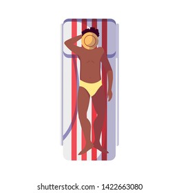 young afro man with swimsuit in tanning mat