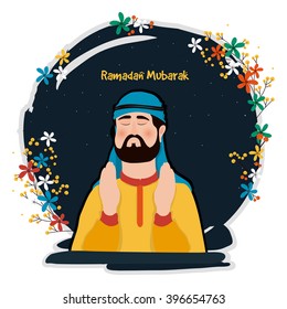 Young Arabian Man reading Namaz (Islamic Prayer) on colourful flowers decorated night background, Concept for Holy Month of Muslim Community, Ramadan Mubarak celebration.