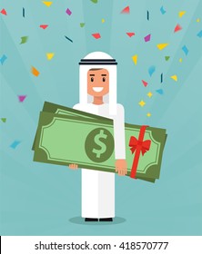 Young arabic guy really happy enjoying and holding huge gift pack of green money/dollars with both hands. Win in a lottery concept