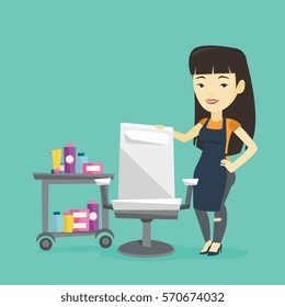 Young asian hair stylist standing near armchair and table with cosmetics in barber shop. Professional hair stylist standing at workplace in barber shop. Vector flat design illustration. Square layout.