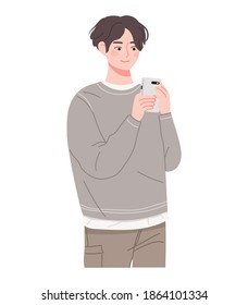 A young Asian male is holding a smartphone. Smartphone use illustration.