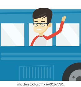 Young asian man enjoying his trip by bus. Happy passenger waving hand from bus window. Tourist peeking out of bus window and waving hand. Vector flat design illustration isolated on white background.