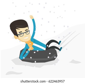 Young asian man sitting in snow rubber tube. Concept of winter leisure activity. Happy man having fun while sledding on snow rubber tube. Vector flat design illustration isolated on white background.