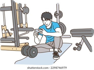 Young asian man using smartphone in gym
