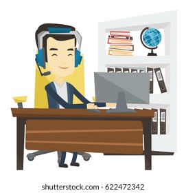 Young asian office worker in headset using computer. Happy office worker in headset working on a computer. Office worker wearing headset. Vector flat design illustration isolated on white background.