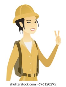 Young asian traveler showing the victory gesture. Traveler showing the victory sign with two fingers. Traveler with victory gesture. Vector flat design illustration isolated on white background.