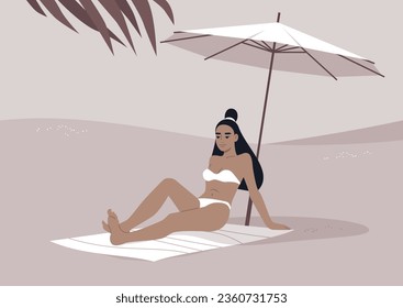 A young Asian woman relaxes on the sandy shore beneath a white beach umbrella, enjoying her summer getaway amidst the sweltering tropical heat