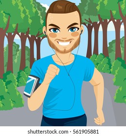 Young attractive man running in park outdoors listening to music
