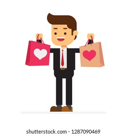 Young attractive man wearing suit and holding shopping bags,Valentines day
