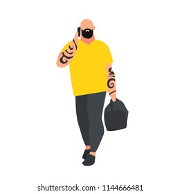 Young bald-headed man with a beard and tattoo on hands in a flat style talking on phone. Man with sport bag. Casual style clothes. Vector illustration.