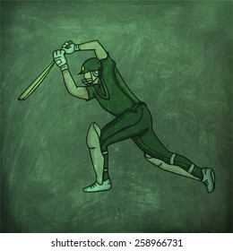 Young batsman in playing action on green chalkboard background.