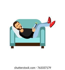 Young bearded man lying on a light blue armchair and using a tablet, man with electronic device vector Illustration