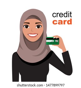 Young beautiful arab woman smiling, showing, presenting credit card for making paymen.
