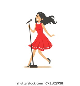 Young beautiful brunette girl in red dress singing a song into the microphone vector Illustration