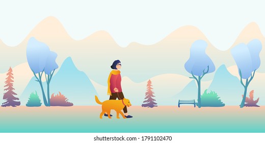 Young beautiful girl in glasses with a dog on a leash walks on a foggy morning. A woman with a pet on a walk against the backdrop of the obstructed sky and mountains.