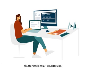 Young beautiful girl programmer behind a laptop and a computer writes a code. Modern flat design, female character IT specialist is typing on the laptop at the work table. Light cozy office.