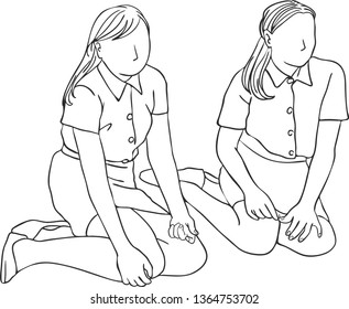 The young beautiful ladies sat on the floor with their knees bend hands on lap.