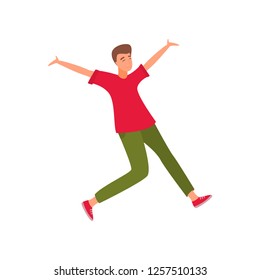 Young beautiful man in fashionable clothes jumping from happiness and fun.
