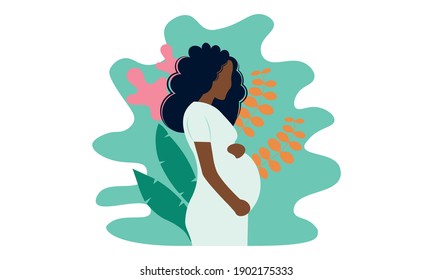 Young beautiful pregnant black woman in nature. Concept for pregnancy, motherhood.