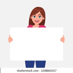 Young beautiful woman smiling and holding a blank / empty sheet of white paper or board. Woman showing a empty poster. Human emotion & body language concept illustration in vector cartoon flat style.